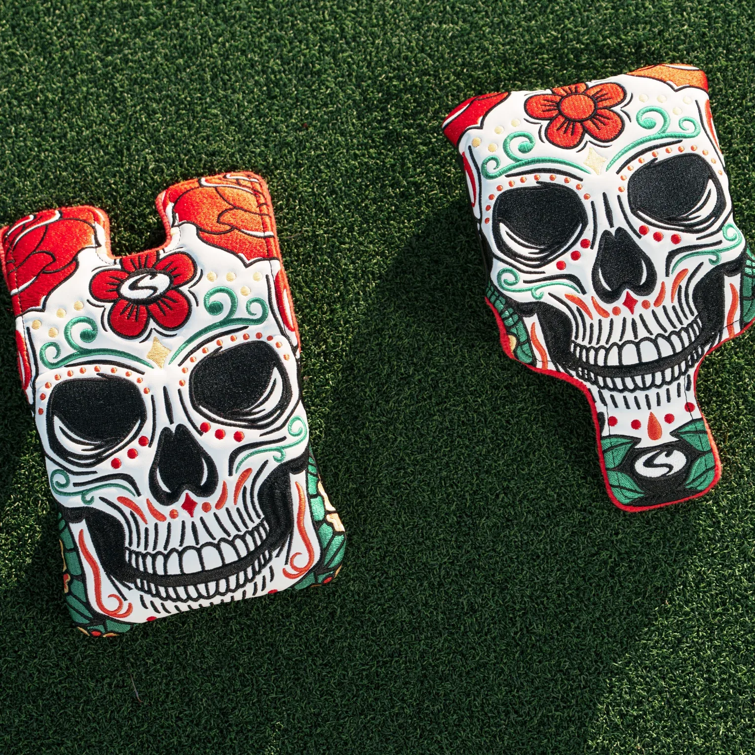 SuperStroke Day of the Dead sugar-skull putter headcovers on turf