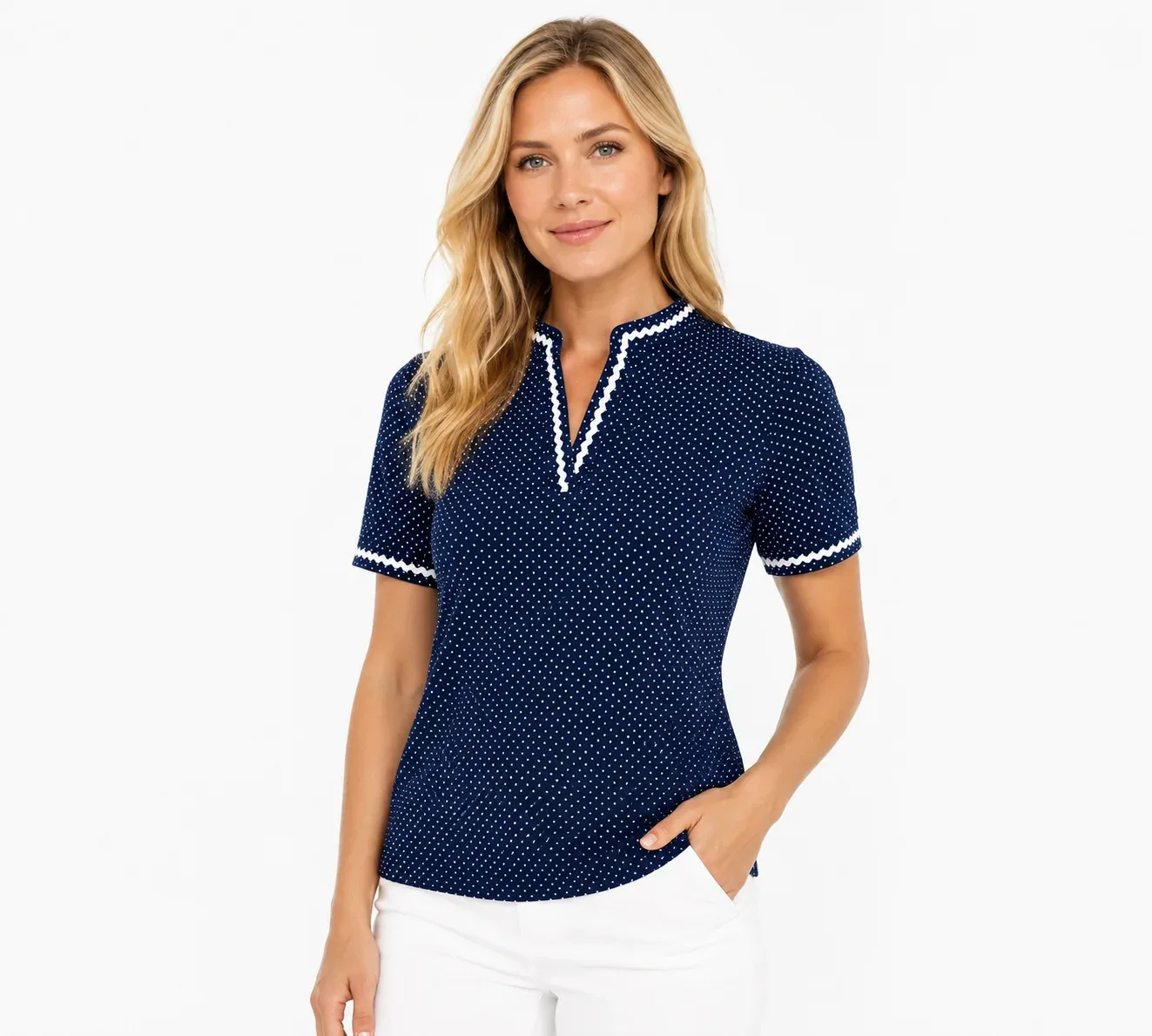 Woman in a navy polka-dot cap-sleeve polo with white trim